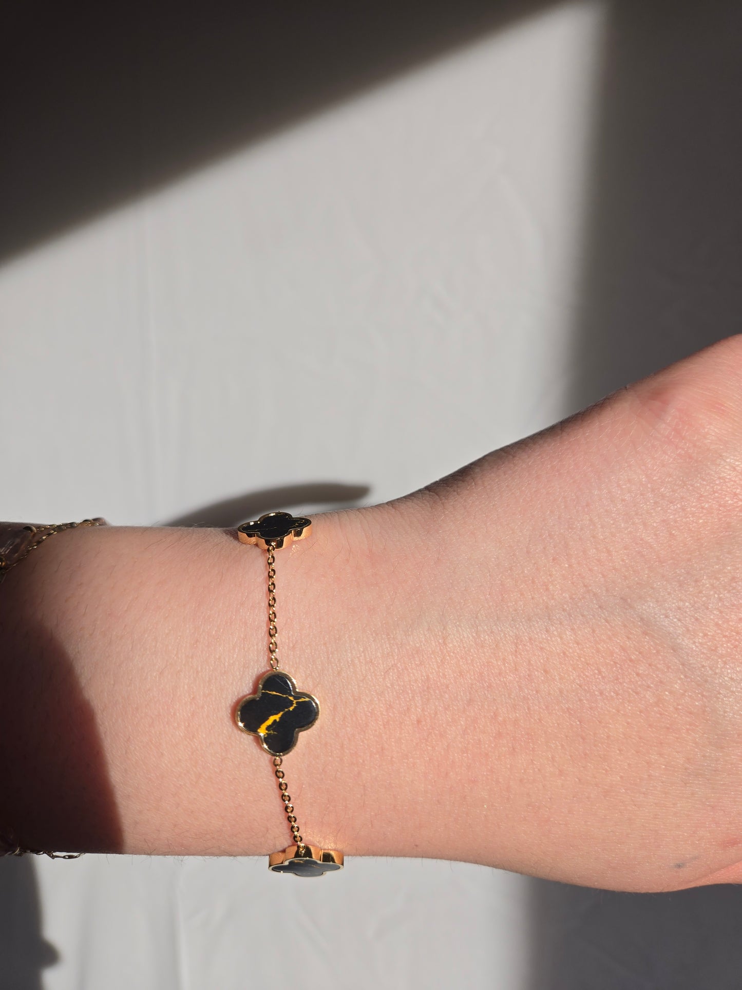 Black and gold clover bracelet